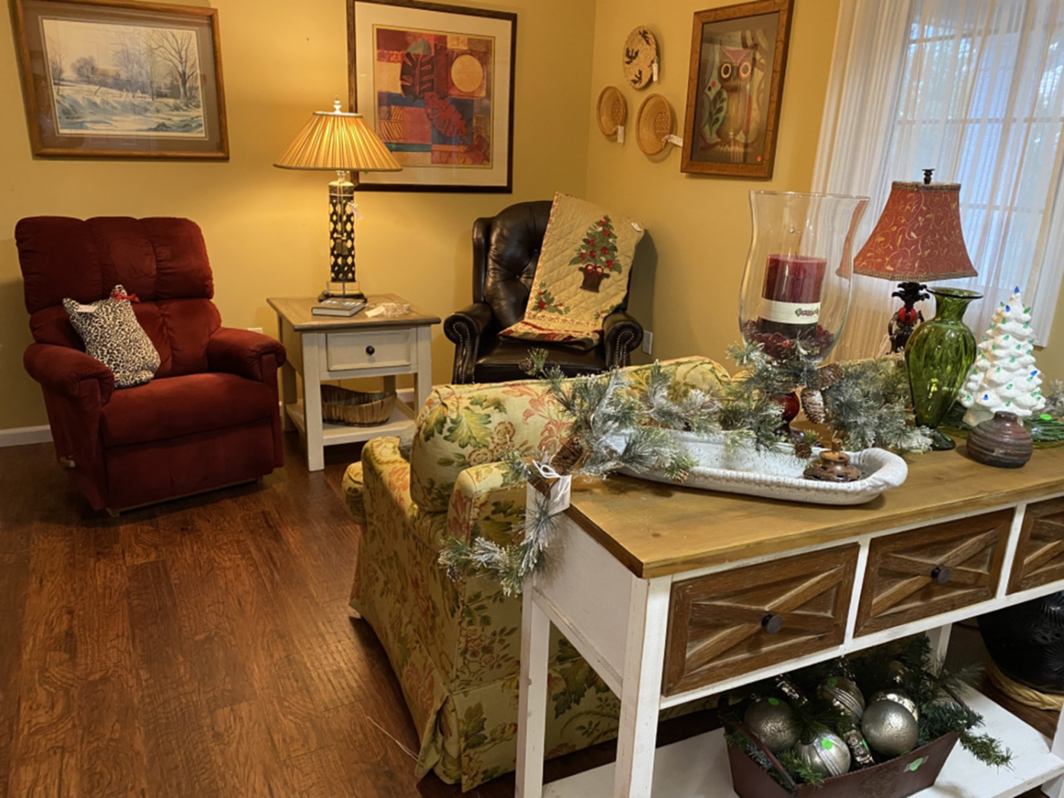 Holiday décor items were displayed among the furniture pieces at the November sale. 