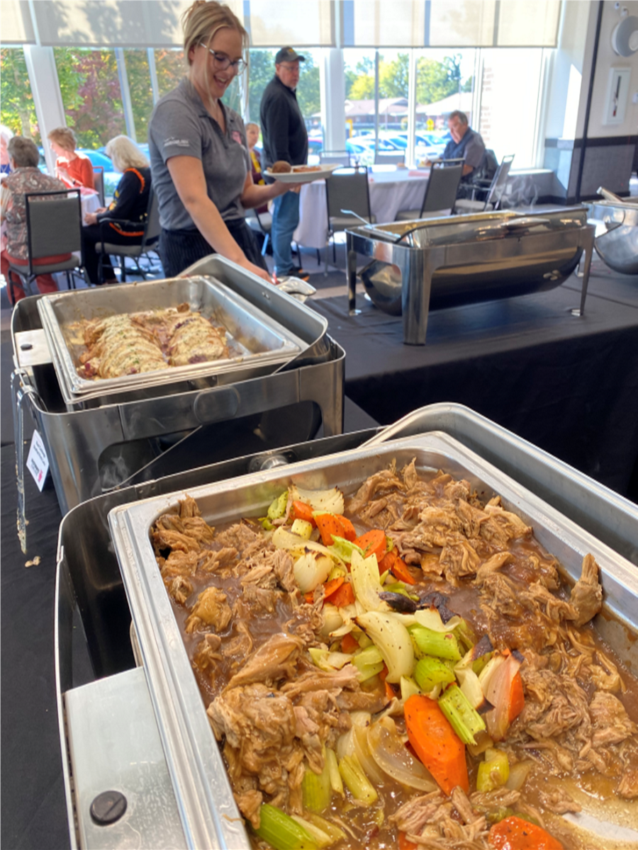 Michaela Hummel, Dining Services Leader find German entrees and side dishes on the lunch buffet.