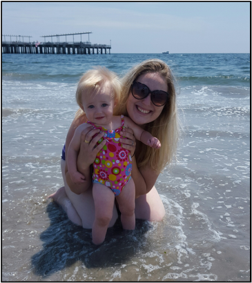 Sarah and Murphy swimming in the ocean at Coney Island Beach.