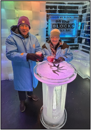 Residents Nelson and Marilyn Galle, wearing parkas provided at ICE!, enjoy a cocktail at the exhibit’s On the Blocks bar. The temperature at the attraction? A frosty 9 degrees!