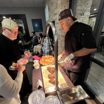 Event attendees enjoyed many culinary delights, including a mouth-watering carving station.