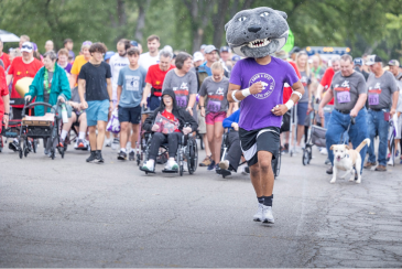 And they’re off! Willie the Wildcat leads the way for the participants in the Half-Mile Memorial Walk. Record numbers of people (and pets!) enjoyed the morning at Tuttle Creek State Park, Saturday, Aug. 26. 