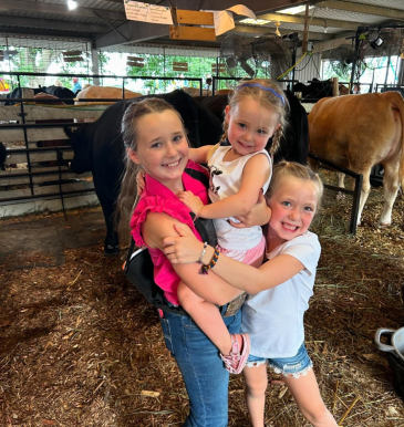 Duggan sisters Murphy, Edie, and Eilish hang out in the barn before the Beef Show