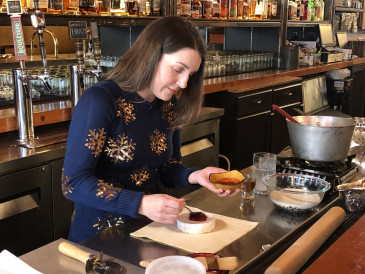 Kirsten Spear, pastry chef at Bourbon and Baker, demonstrates how to make Baked Brie for the Meadowlark Holiday Classic. 