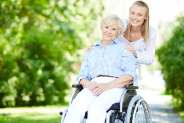 A young woman and an older woman in a wheelchair