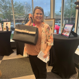 Linda Montgomery, Social Services Leader at Meadowlark, won the raffle prize featuring a Kate Spade bag with goodies inside! 